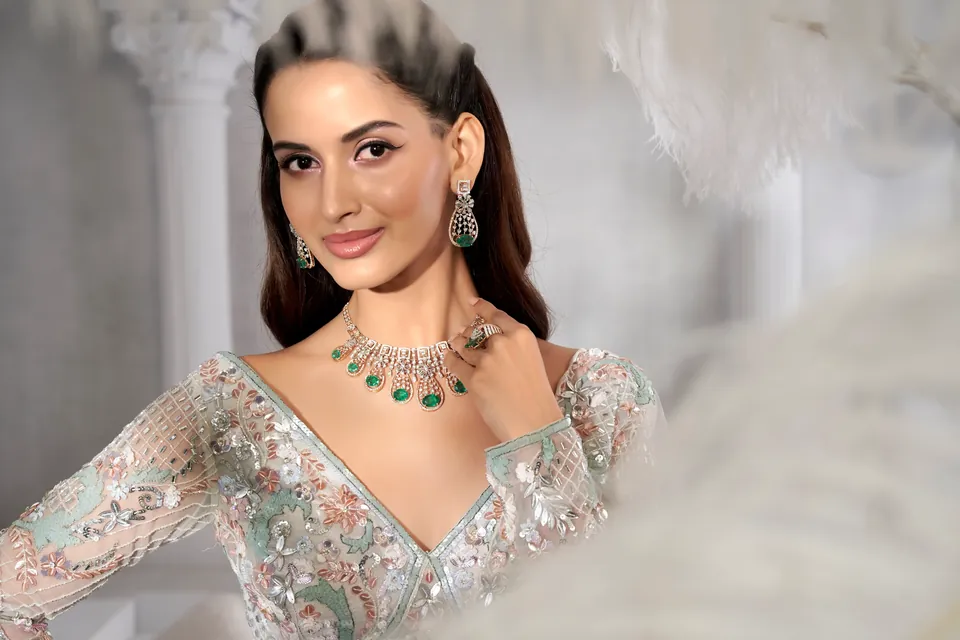 Smiling portrait with a diamond necklace of green drops and long earrings